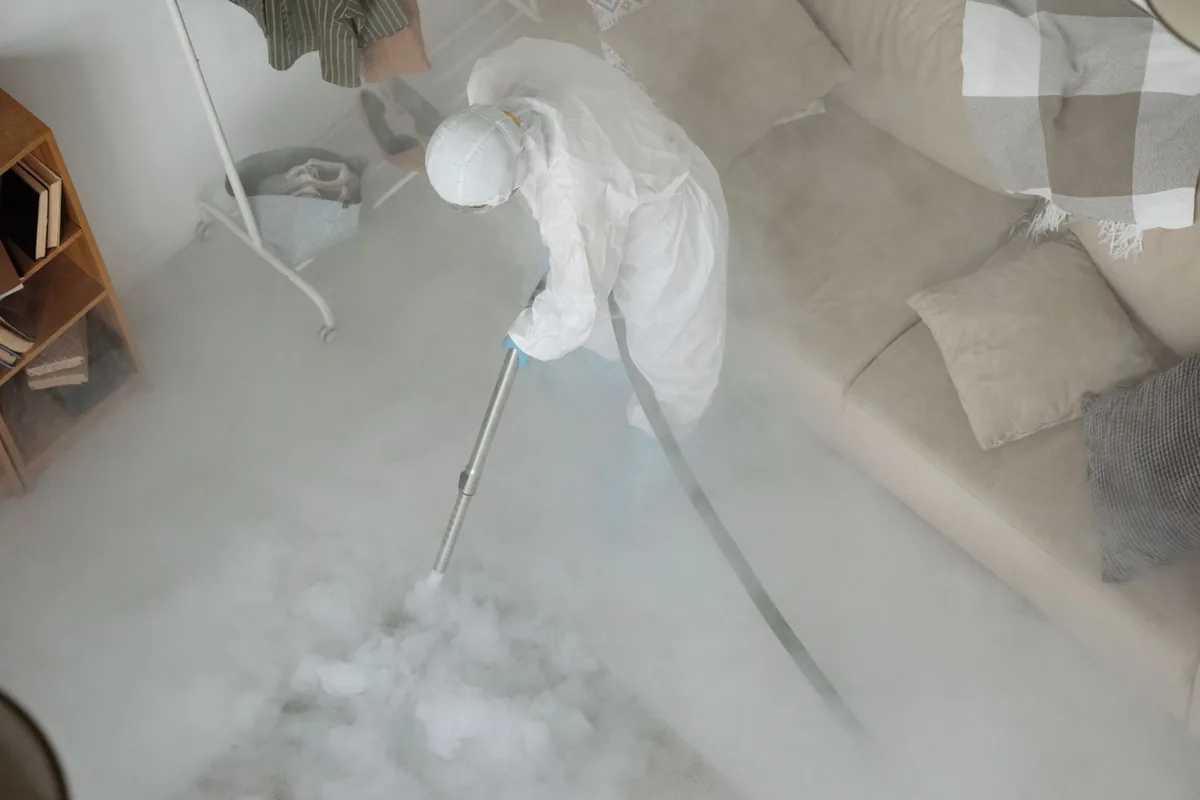 Biohazard cleanup technician in protective equipment, Little Round Lake, WI